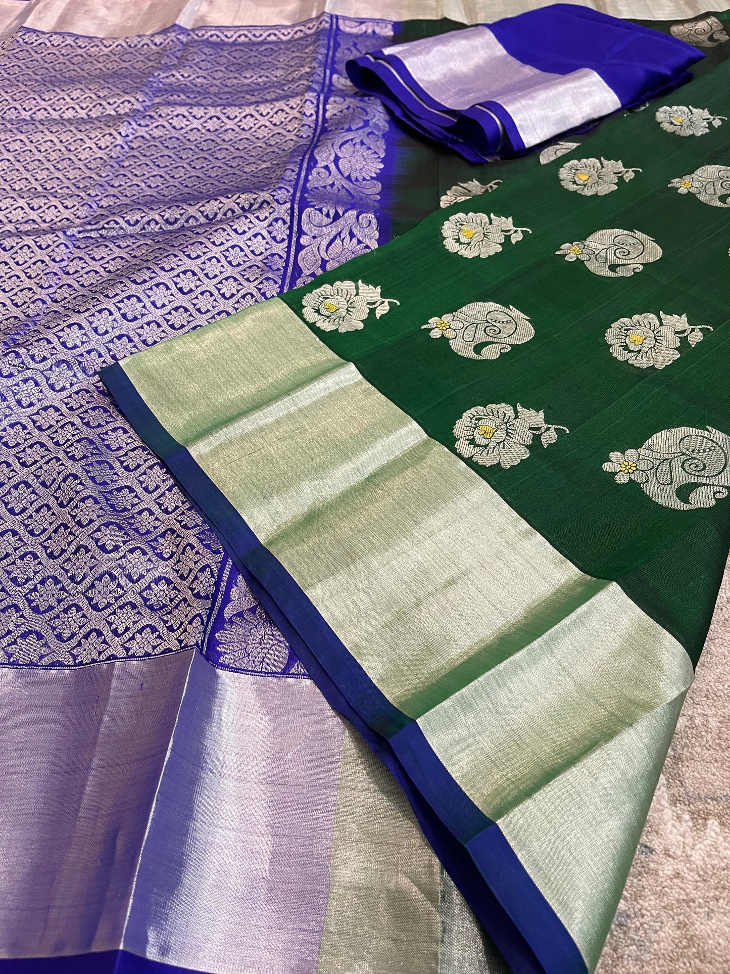 Elegant Dark Green Silk Saree with Blue Borders and Zari Motifs