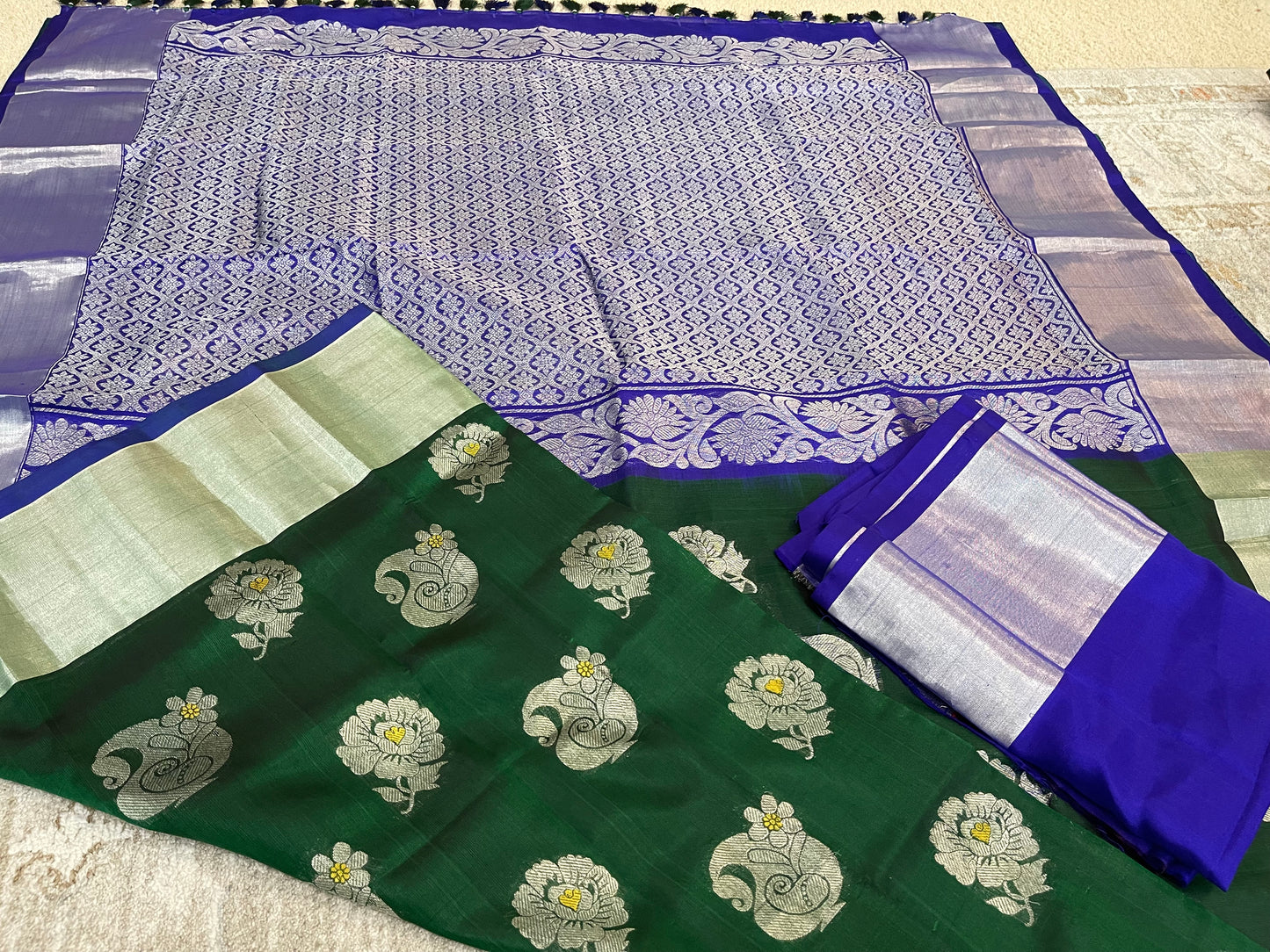 Elegant Dark Green Silk Saree with Blue Borders and Zari Motifs