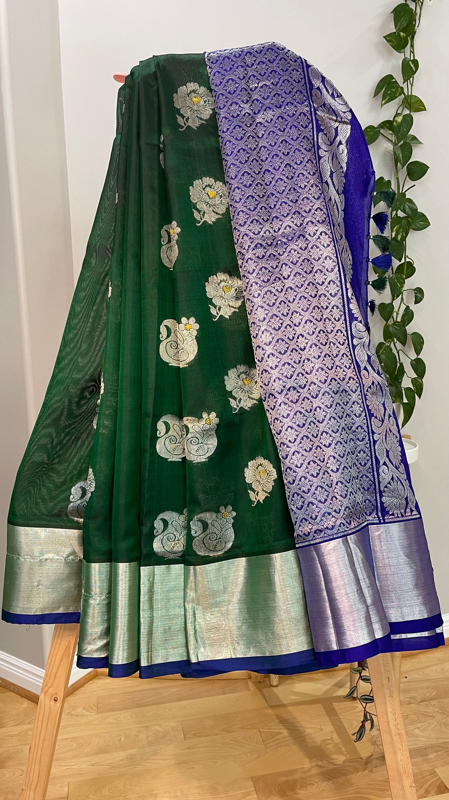 Elegant Dark Green Silk Saree with Blue Borders and Zari Motifs